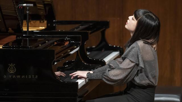 pianist performing at the piano